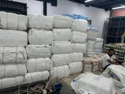 Bales ready for loading, with printed stock alongside