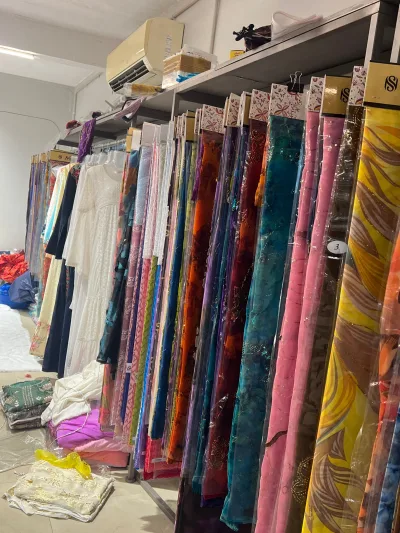 Fabric rails and ready garments in our Surat showroom